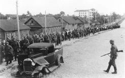 A column of Red Army POWs captured near Minsk is marched west. 
